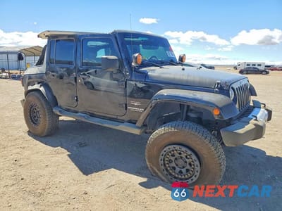 Czwarte zdjęcie samochodu z boku: 2012 JEEP WRANGLER UNLIMITED SAHARA VIN:1C4HJWEG2CL134598 - miniatura