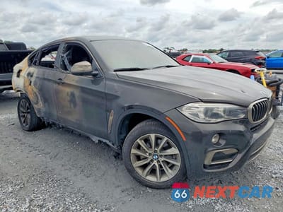Czwarte zdjęcie samochodu z boku: 2019 BMW X6 SDRIVE35I VIN:5UXKU0C52K0H98767 - miniatura