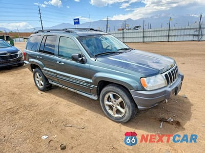 Czwarte zdjęcie samochodu z boku: 2002 JEEP GRAND CHEROKEE VIN:1J8GW68J12C206709 - miniatura