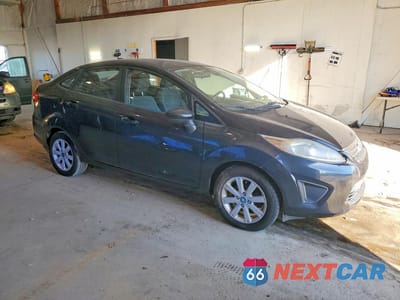 Czwarte zdjęcie samochodu z boku: 2011 FORD FIESTA SE VIN:3FADP4BJ2BM228341 - miniatura
