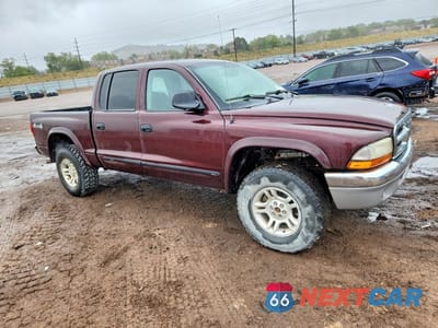 Czwarte zdjęcie samochodu z boku: 2004 DODGE DAKOTA QUAD SLT VIN:1D7HG48NX4S556273 - miniatura