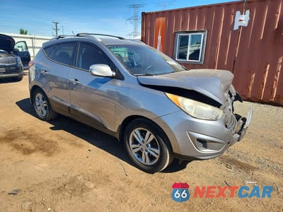 Czwarte zdjęcie samochodu z boku: 2012 HYUNDAI TUCSON GLS VIN:KM8JUCAC2CU529462 - miniatura