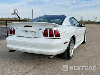 Czwarte zdjęcie samochodu z boku: 1997 FORD MUSTANG COBRA VIN:1FALP47V5VF111087 - miniatura