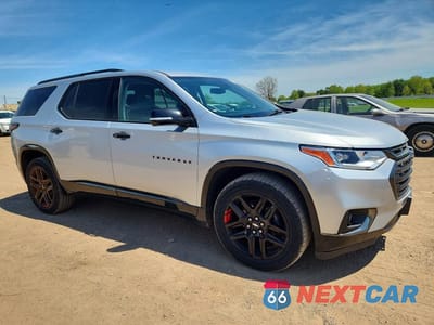Czwarte zdjęcie samochodu z boku: 2019 CHEVROLET TRAVERSE PREMIER VIN:1GNEVKKW9KJ159592 - miniatura