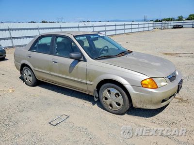 Czwarte zdjęcie samochodu z boku: 1999 MAZDA PROTEGE DX VIN:JM1BJ2228X0194402 - miniatura