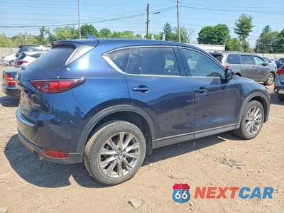 Trzecie zdjęcie samochodu z tyłu: 2021 MAZDA CX-5 GRAND TOURING VIN:JM3KFADM3M0478470 - miniatura
