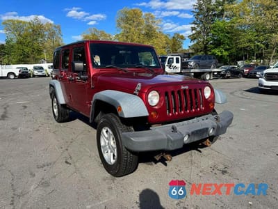 Czwarte zdjęcie samochodu z boku: 2012 JEEP WRANGLER UNLIMITED SPORT VIN:1C4BJWDG0CL121971 - miniatura