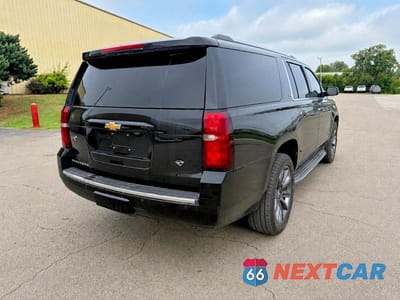 Czwarte zdjęcie samochodu z boku: 2015 CHEVROLET SUBURBAN K1500 LTZ VIN:1GNSKKKC2FR158597 - miniatura