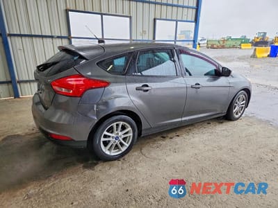 Trzecie zdjęcie samochodu z tyłu: 2018 FORD FOCUS SE VIN:1FADP3K25JL236291 - miniatura