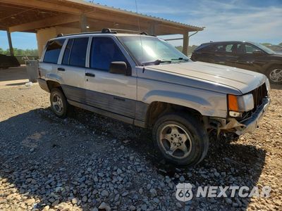 Czwarte zdjęcie samochodu z boku: 1998 JEEP GRAND CHEROKEE LAREDO VIN:1J4FX58S5WC340903 - miniatura