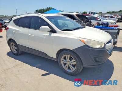 Czwarte zdjęcie samochodu z boku: 2011 HYUNDAI TUCSON GLS VIN:KM8JU3AC3BU314543 - miniatura