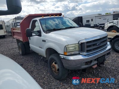 Czwarte zdjęcie samochodu z boku: 2003 FORD F350 SUPER DUTY DUMP TRUCK VIN:1FDWF37P83ED28525 - miniatura