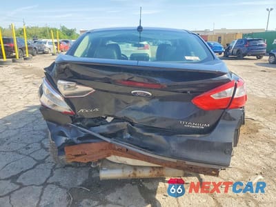 Zdjęcie 6 z 12 samochodu: 2013 FORD FOCUS TITANIUM VIN:1FADP3J26DL276207 - miniatura