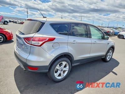 Trzecie zdjęcie samochodu z tyłu: 2016 FORD ESCAPE SE VIN:1FMCU9GX9GUB61731 - miniatura