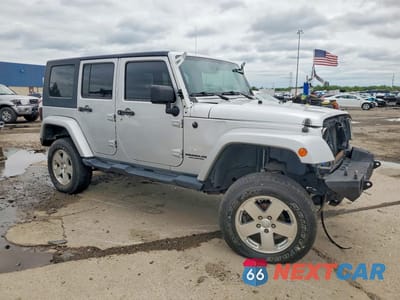 Czwarte zdjęcie samochodu z boku: 2009 JEEP WRANGLER UNLIMITED SAHARA VIN:1J4GA59119L751666 - miniatura