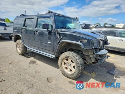 Czwarte zdjęcie samochodu z boku: 2005 HUMMER H2 VIN:5GRGN23U65H110648 - miniatura