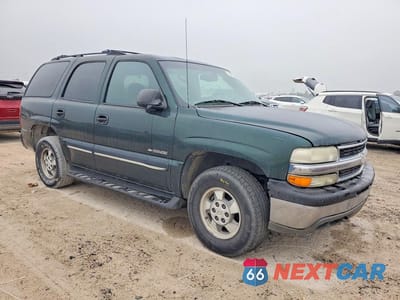 Czwarte zdjęcie samochodu z boku: 2001 CHEVROLET TAHOE C1500 VIN:1GNEC13T91R188580 - miniatura