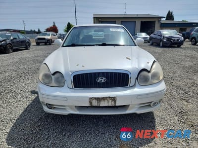 Piąte zdjęcie samochodu w środku: 2002 HYUNDAI SONATA GL VIN:KMHWF25S32A521639 - miniatura