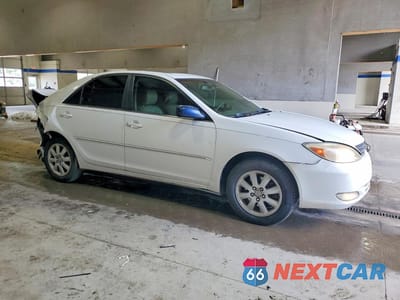 Czwarte zdjęcie samochodu z boku: 2003 TOYOTA CAMRY XLE V6 VIN:JTDBF30K430112363 - miniatura
