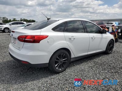 Trzecie zdjęcie samochodu z tyłu: 2018 FORD FOCUS VIN:1FADP3F20JL250402 - miniatura