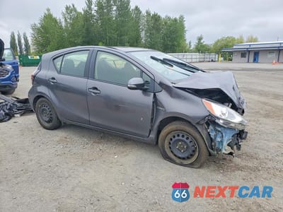 Czwarte zdjęcie samochodu z boku: 2015 TOYOTA PRIUS C TWO VIN:JTDKDTB3XF1111471 - miniatura
