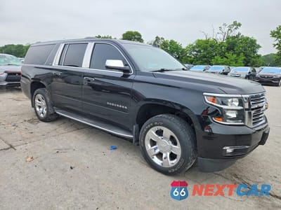 Czwarte zdjęcie samochodu z boku: 2015 CHEVROLET SUBURBAN K1500 LTZ VIN:1GNSKKKC0FR540613 - miniatura