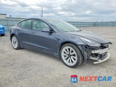 Czwarte zdjęcie samochodu z boku: 2022 TESLA MODEL 3 VIN:5YJ3E1EB5NF349016 - miniatura