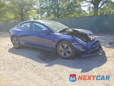 Czwarte zdjęcie samochodu z boku: 2022 TESLA MODEL 3 VIN:5YJ3E1EBXNF179574 - miniatura