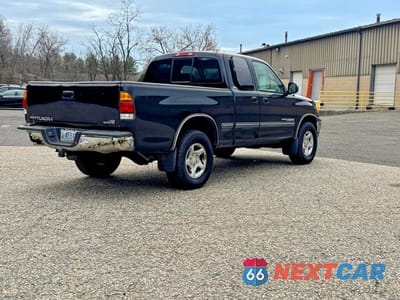 Czwarte zdjęcie samochodu z boku: 2001 TOYOTA TUNDRA SR5 VIN:5TBRT34181S200036 - miniatura