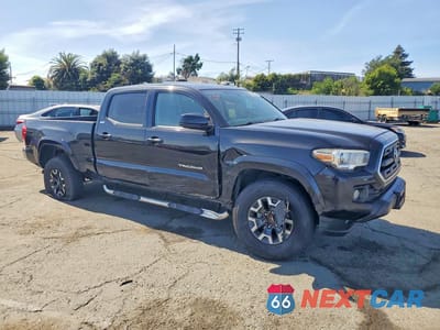 Czwarte zdjęcie samochodu z boku: 2016 TOYOTA TACOMA SR5 V6 VIN:3TMBZ5DN9GM003729 - miniatura