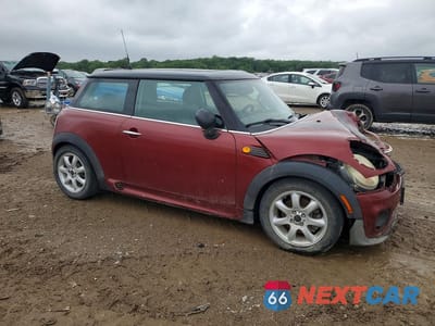 Czwarte zdjęcie samochodu z boku: 2009 MINI COOPER VIN:WMWMF335X9TW72889 - miniatura