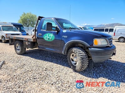 Czwarte zdjęcie samochodu z boku: 2001 FORD F150 VIN:1FTZF18271KF02379 - miniatura