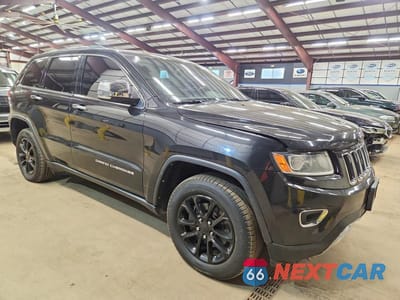 Czwarte zdjęcie samochodu z boku: 2014 JEEP GRAND CHEROKEE LIMITED VIN:1C4RJFBG0EC103782 - miniatura