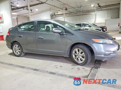 Czwarte zdjęcie samochodu z boku: 2010 HONDA INSIGHT EX VIN:JHMZE2H78AS004520 - miniatura