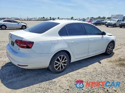 Trzecie zdjęcie samochodu z tyłu: 2017 VOLKSWAGEN JETTA SE VIN:3VWDB7AJ5HM313255 - miniatura