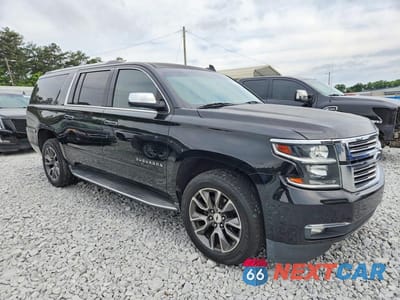Czwarte zdjęcie samochodu z boku: 2017 CHEVROLET SUBURBAN C1500 PREMIER VIN:1GNSCJKC0HR213803 - miniatura