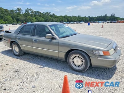 Czwarte zdjęcie samochodu z boku: 2002 MERCURY GRAND MARQUIS LS VIN:2MEFM75W32X654854 - miniatura