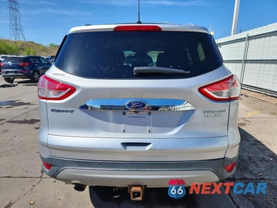 Zdjęcie 6 z 13 samochodu: 2016 FORD ESCAPE TITANIUM VIN:1FMCU0J97GUC11838 - miniatura