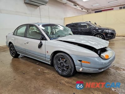 Czwarte zdjęcie samochodu z boku: 2002 SATURN SL2 VIN:1G8ZK54712Z111834 - miniatura