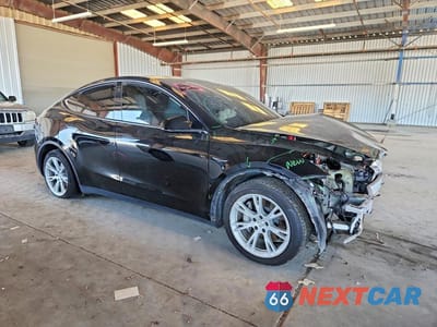 Czwarte zdjęcie samochodu z boku: 2022 TESLA MODEL Y VIN:7SAYGAEE4NF428318 - miniatura