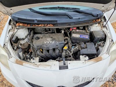 Zdjęcie 11 z 12 samochodu: 2009 TOYOTA YARIS BASE VIN:JTDBT903394060083 - miniatura