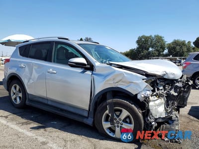 Czwarte zdjęcie samochodu z boku: 2015 TOYOTA RAV4 XLE VIN:2T3WFREV3FW149296 - miniatura