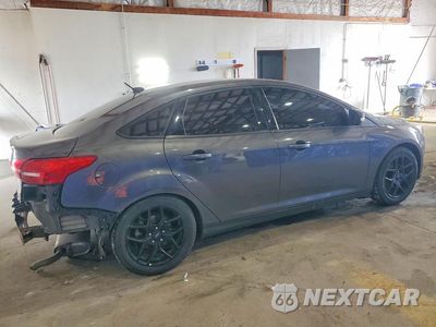 Trzecie zdjęcie samochodu z tyłu: 2016 FORD FOCUS SE VIN:1FADP3F2XGL406793 - miniatura