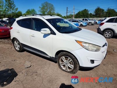 Czwarte zdjęcie samochodu z boku: 2012 HYUNDAI TUCSON GLS VIN:KM8JUCAC8CU336927 - miniatura