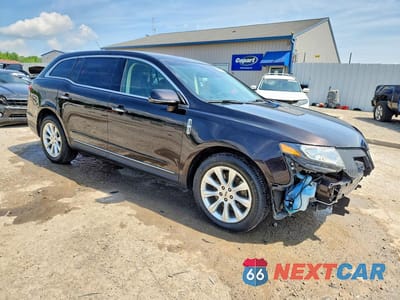 Czwarte zdjęcie samochodu z boku: 2014 LINCOLN MKT VIN:2LMHJ5FK6EBL58554 - miniatura