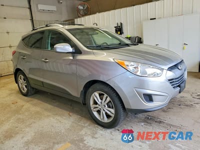 Czwarte zdjęcie samochodu z boku: 2012 HYUNDAI TUCSON GLS VIN:KM8JU3AC4CU515045 - miniatura
