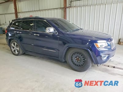 Czwarte zdjęcie samochodu z boku: 2014 JEEP GRAND CHEROKEE OVERLAND VIN:1C4RJFCT6EC448892 - miniatura