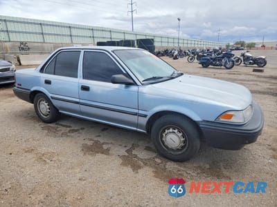 Czwarte zdjęcie samochodu z boku: 1990 TOYOTA COROLLA DLX VIN:1NXAE94A6LZ086839 - miniatura