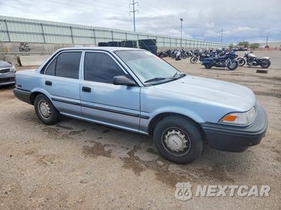 Czwarte zdjęcie samochodu z boku: 1990 TOYOTA COROLLA DLX VIN:1NXAE94A6LZ086839 - miniatura