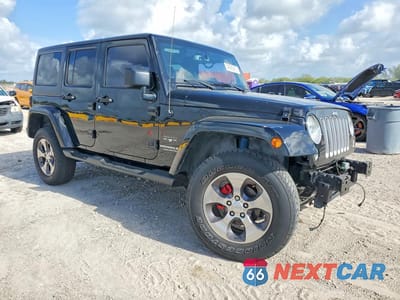 Czwarte zdjęcie samochodu z boku: 2016 JEEP WRANGLER UNLIMITED SAHARA VIN:1C4BJWEG1GL283693 - miniatura
